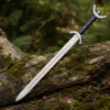 Decorative Celtic knight sword featuring a polished blade and crescent crossguard.