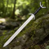 Medieval Celtic War Sword with brown leather scabbard in a forest setting.