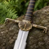 Dark Sister-inspired replica sword with polished stainless steel blade and ornate metal hilt mounted on a decorative wall plaque.