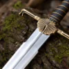 Dark Sister-inspired replica sword with polished stainless steel blade and ornate metal hilt mounted on a decorative wall plaque.