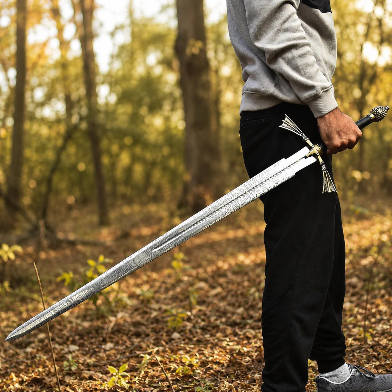 Dark Sister Sword replica with Damascus-style blade and ornate gold crossguard inspired by Game of Thrones.