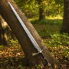 Dark Sister Sword replica with Damascus-style blade and ornate gold crossguard inspired by Game of Thrones.