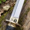 Yin Yang Katana with polished steel blade, black wrapped handle, gold-tone Yin Yang guard, and matching black scabbard.