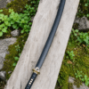Yin Yang Katana with polished steel blade, black wrapped handle, gold-tone Yin Yang guard, and matching black scabbard.