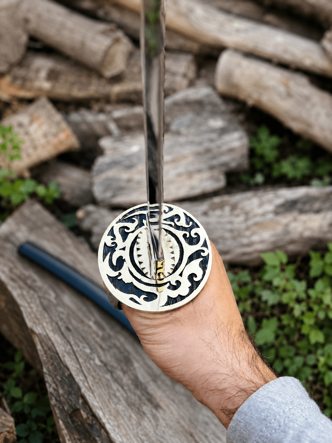 Yin Yang Katana with polished steel blade, black wrapped handle, gold-tone Yin Yang guard, and matching black scabbard.