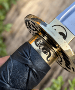 Yin Yang Katana with polished steel blade, black wrapped handle, gold-tone Yin Yang guard, and matching black scabbard.