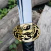 Yin Yang Katana with polished steel blade, black wrapped handle, gold-tone Yin Yang guard, and matching black scabbard.