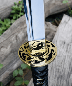 Yin Yang Katana with polished steel blade, black wrapped handle, gold-tone Yin Yang guard, and matching black scabbard.