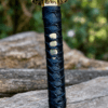 Yin Yang Katana with polished steel blade, black wrapped handle, gold-tone Yin Yang guard, and matching black scabbard.